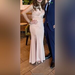 formal dress, cross back. wore once, professionally cleaned champagne color.